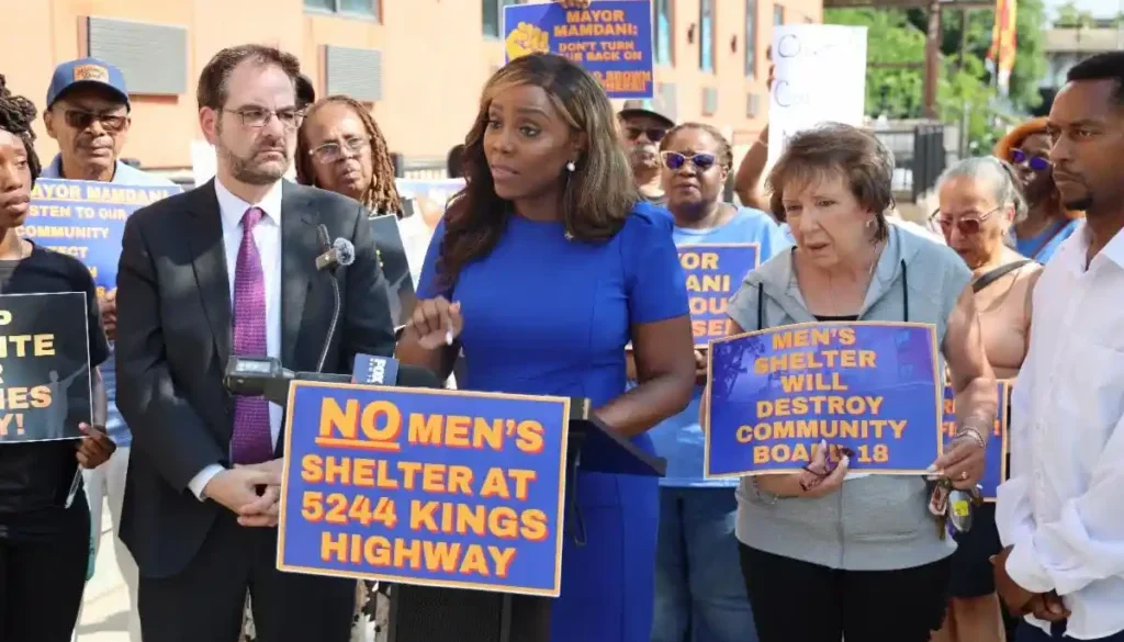 Council-Member-Farah-N.-Louis-flanked-by-Assemblymember-Kalman-Yeger-addresses-rally.-