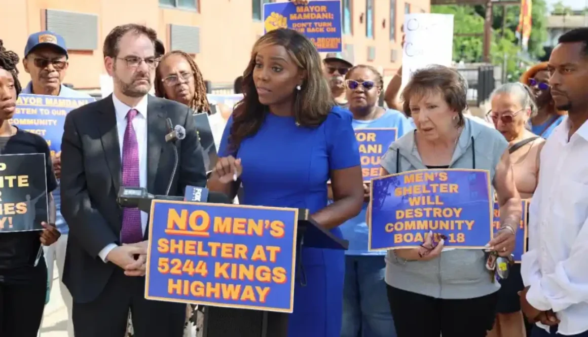 Council-Member-Farah-N.-Louis-flanked-by-Assemblymember-Kalman-Yeger-addresses-rally.-