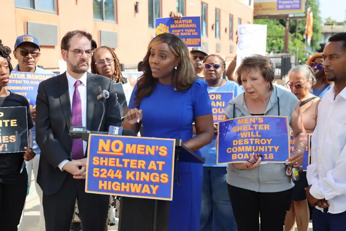 Council-Member-Farah-N.-Louis-flanked-by-Assemblymember-Kalman-Yeger-addresses-rally.-